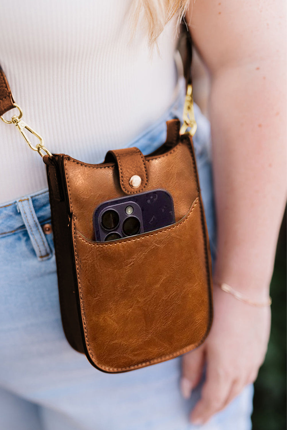 close up view of crossbody bag in color coffee