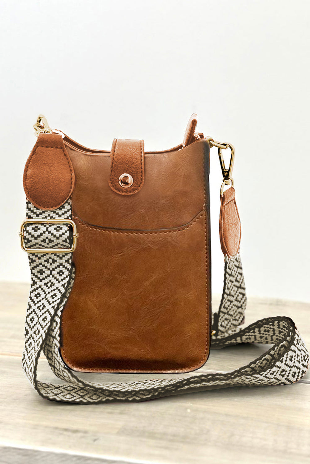 front view of crossbody bag in color coffee